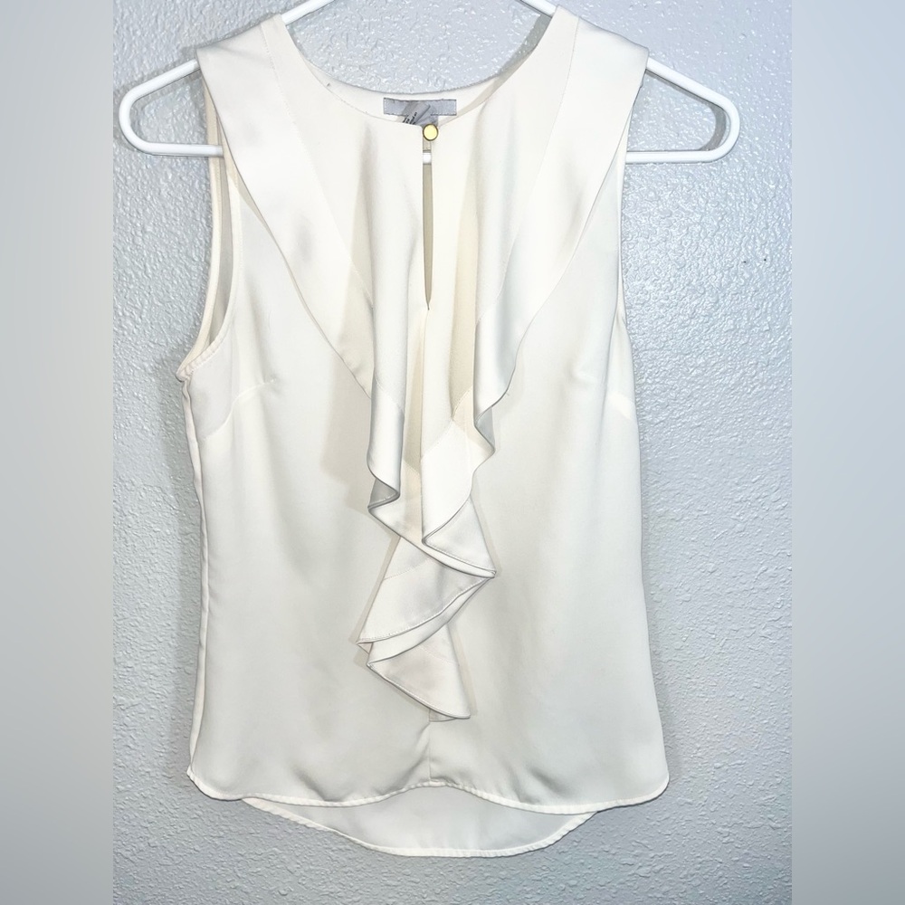 H&M cream ruffled sleeveless blouse